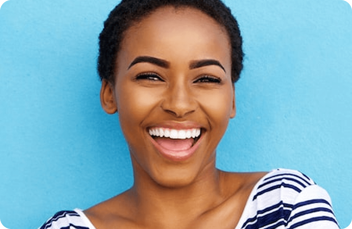 Blue painted wall and woman smiling